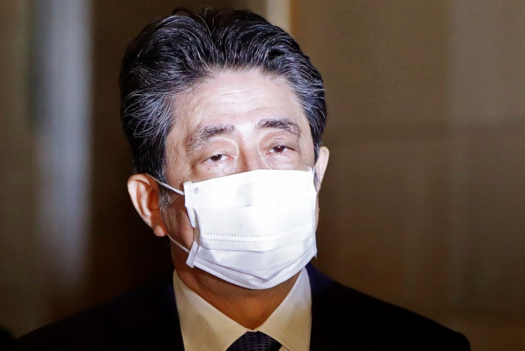 Former Japanese Prime Minister Shinzo Abe arrives at the parliament building to attend a parliament session to face questioning over a possible violat...