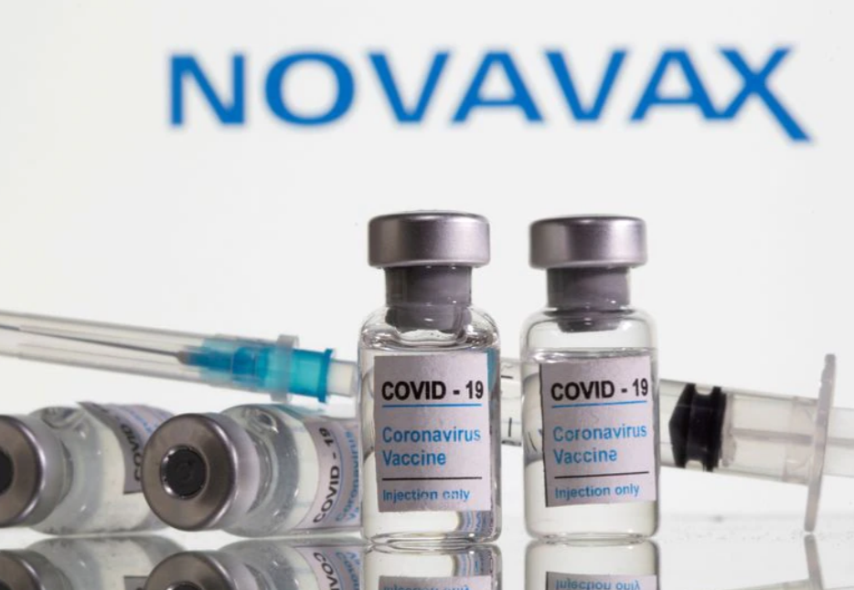 Vials labelled "COVID-19 Coronavirus Vaccine" and sryinge are seen in front of displayed Novavax. (Reuters photo)
