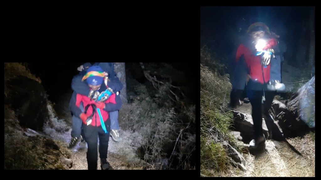 Rescue team members take turns carrying a hiker down Yushan. (Facebook, Yushan National Park photo)
