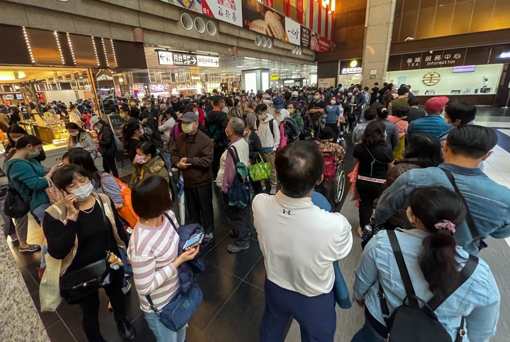 People lining up for a COVID shot at Taipei Railway Station. 
