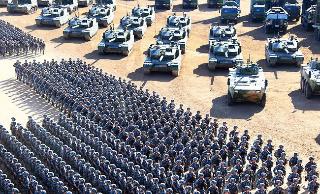 PLA troops march past military vehicles in 2017 in Inner Mongolia.
