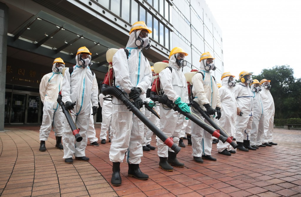 A Taipei City health department crew disinfecting Academia Sinica Friday. 
