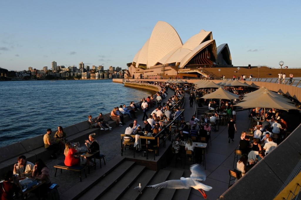 Patrons dine-in at a bar by the harbour in the wake of coronavirus disease (COVID-19) regulations easing, following an extended lockdown to curb an ou...