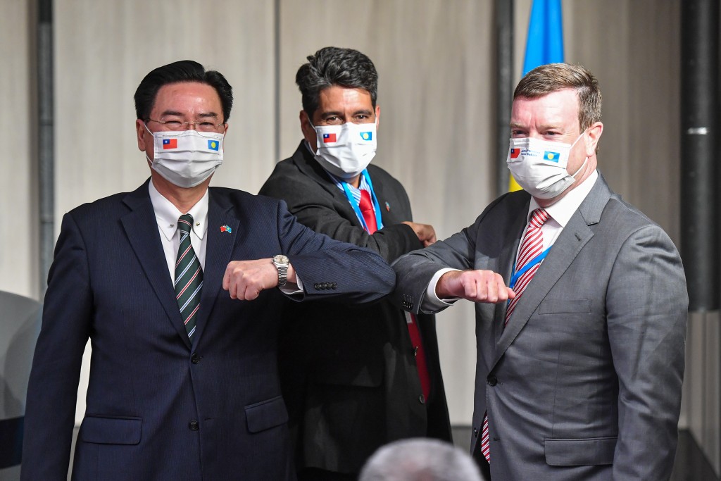 Foreign Minister Joseph Wu (left), Palau President Surangel Whipps Jr. (center), US Ambassador to Palau John Hennessey-Niland (right). ...