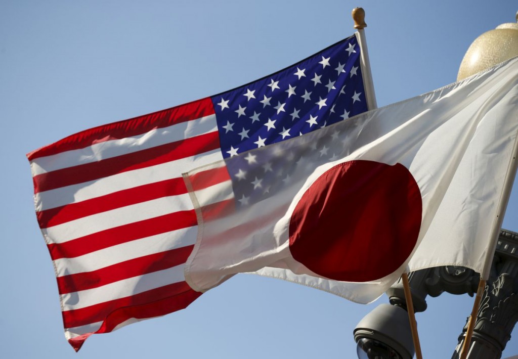 The U.S. and Japan flags fly together outside the White House in Washington April 27, 2015. REUTERS/Kevin Lamarque
