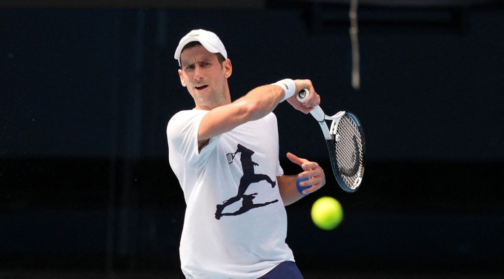  

Serbian tennis player Novak Djokovic practices ahead of the Australian Open at Melbourne Park in Melbourne, Australia, January 11, 2022. Tenni...