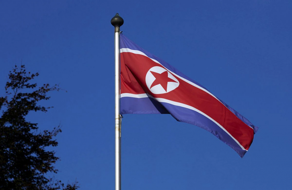 FILE PHOTO - A North Korean flag flies on a mast at the Permanent Mission of North Korea in Geneva October 2, 2014. REUTERS/Denis Balibouse/File Pictu...