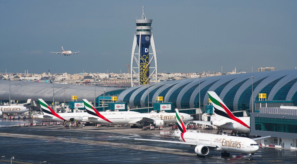 An Emirates jetliner comes in for landing at the Dubai International Airport in Dubai, United Arab Emirates, Dec. 11, 2019. 
