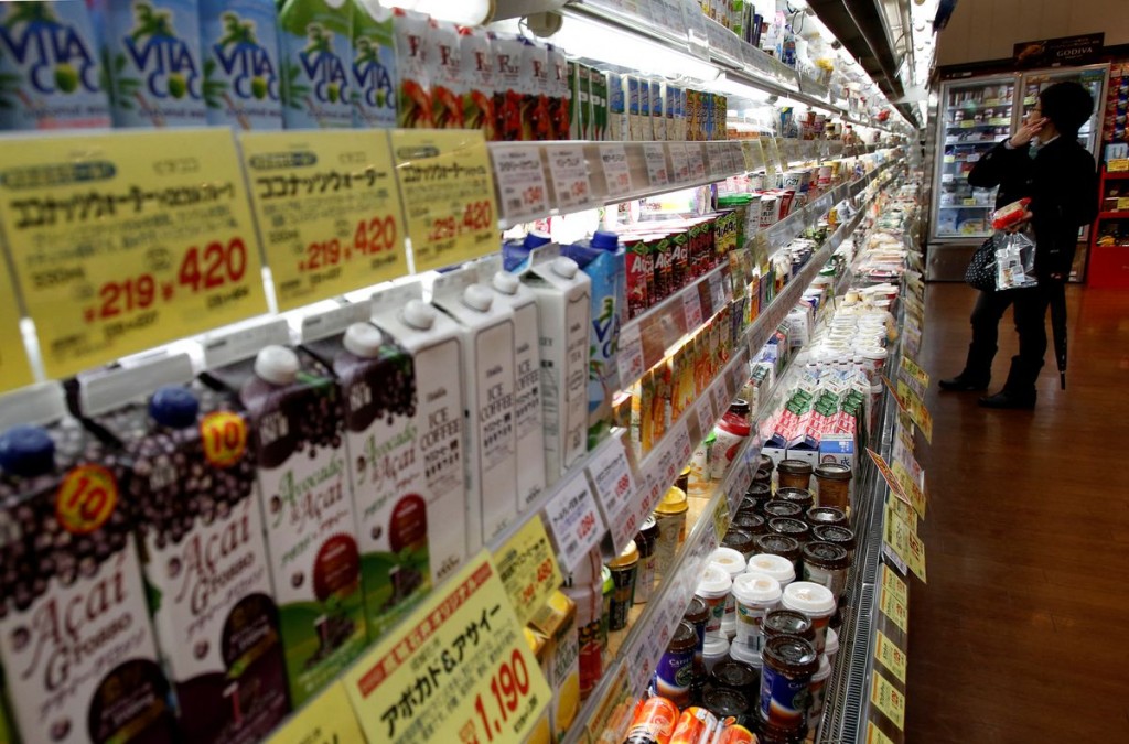 A shopper looks at items at a supermarket in Tokyo February 26, 2015. REUTERS/Yuya Shino
