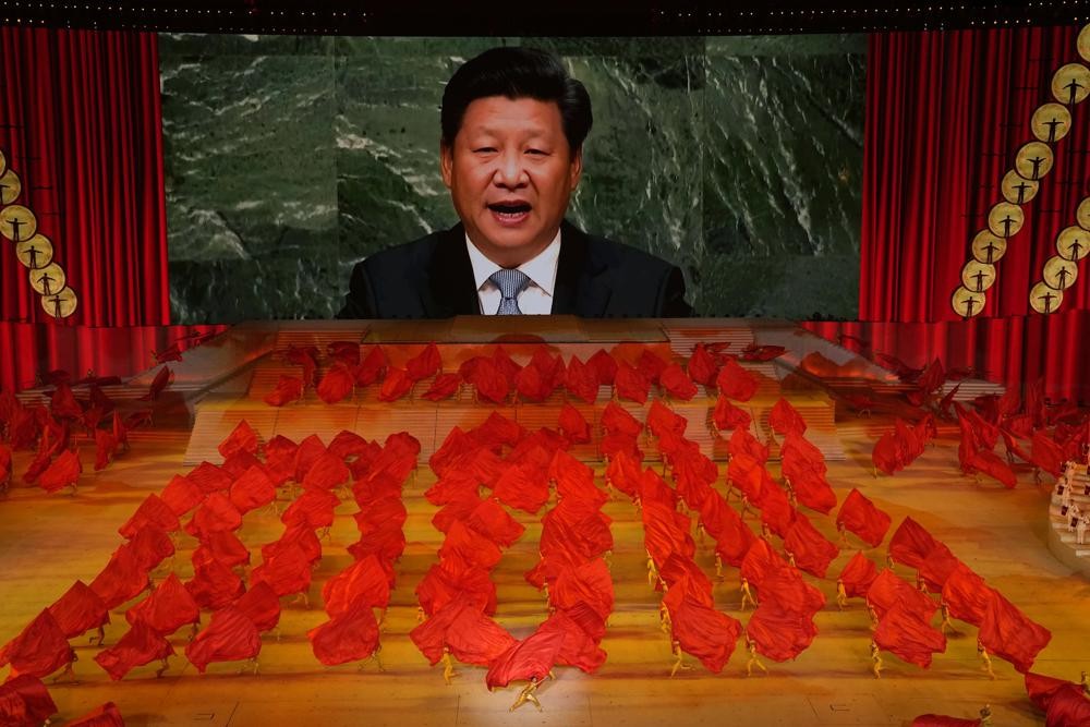 Chinese leader Xi Jinping on a screen at a Communist Party event in 2021. 
