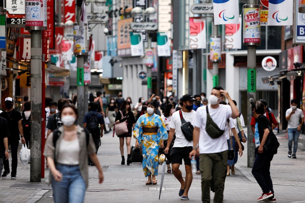People walk in Shibuya shopping area, during a state of emergency amid the coronavirus disease (COVID-19) outbreak in Tokyo, Japan August 29, 2021. RE...