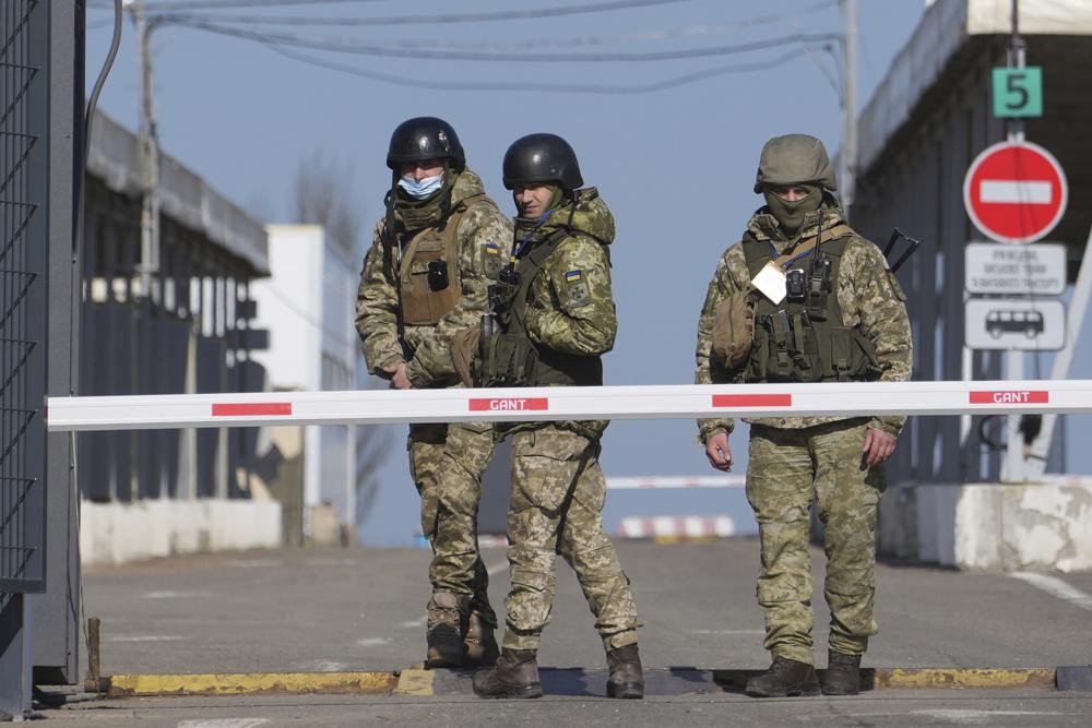 Ukrainian border guards near an area held by pro-Russian militias. 
