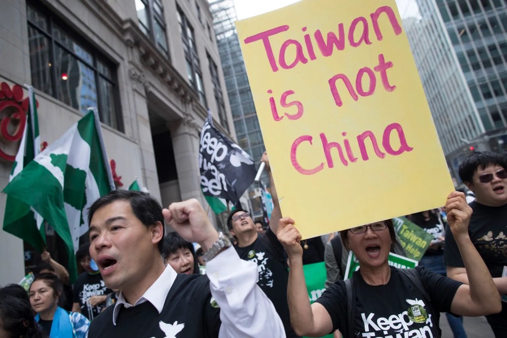 Demonstrators chant slogans during a rally and march to protest Taiwan’s continued exclusion from the United Nations. 
