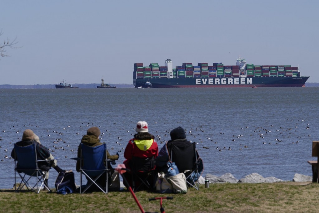 Ship spotters soak up the view of the immovable Ever Forward at Downs Park in Maryland. (AP photo) 
