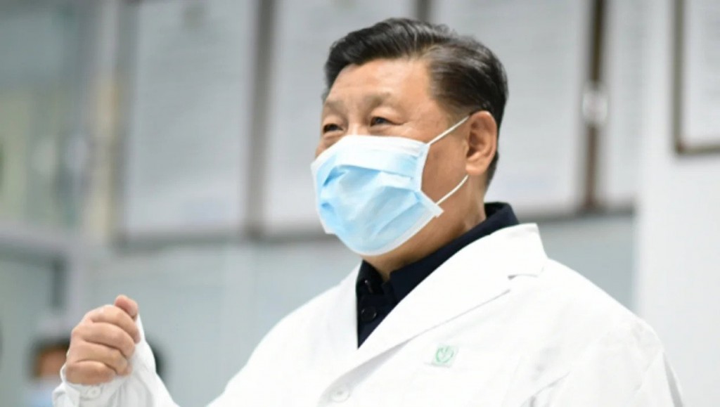 A masked Xi Jinping in a lab coat. (Getty Images)
