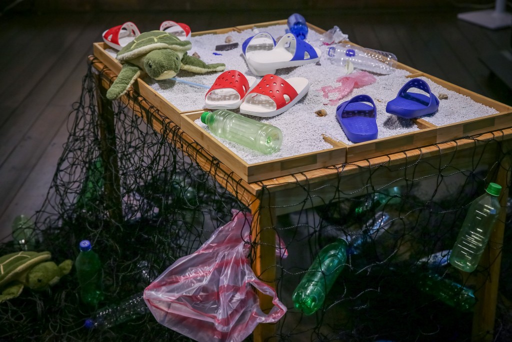 9,375 plastic bottles picked up at beaches and in the ocean were made into 2,440 pairs of eco-friendly slippers under "Project Blue." (Busin...