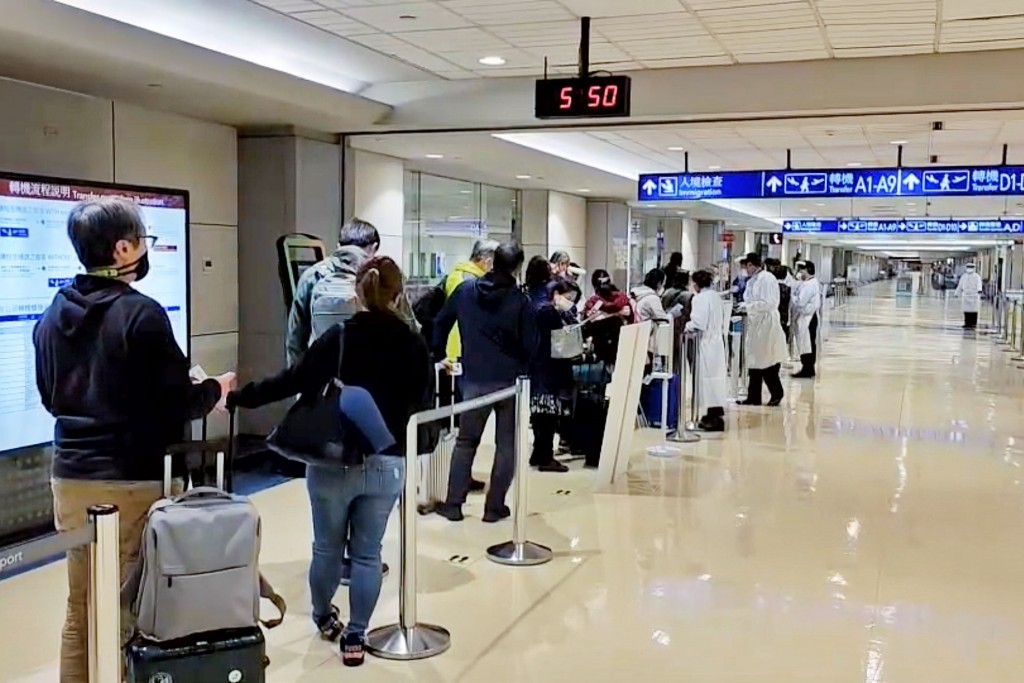 Passengers arriving from overseas at Taiwan Taoyuan International Airport. 
