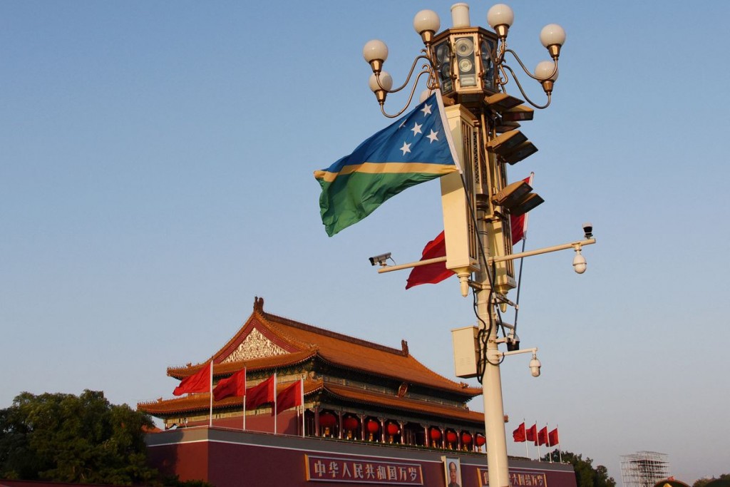 National flags of Solomon Islands and China flutter at the Tiananmen Square in Beijing, China October 7, 2019. REUTERS/Stringer /File Photo
