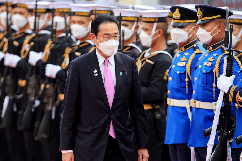  

Japan's Prime Minister Fumio Kishida reviews an honour guard as he meets with his Thai counterpart Prayuth Chan-ocha during his official v...