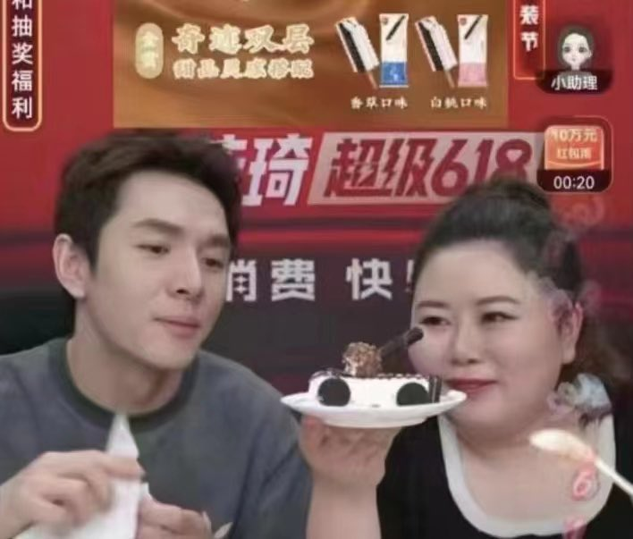 Austin Li (left) looking at ice cream cake shaped like a tank. (Twitter image)
