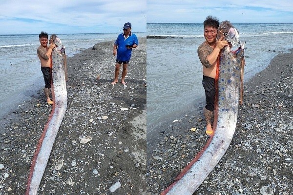 Lin holding huge oarfish that he caught on Thursday (June 9). 
