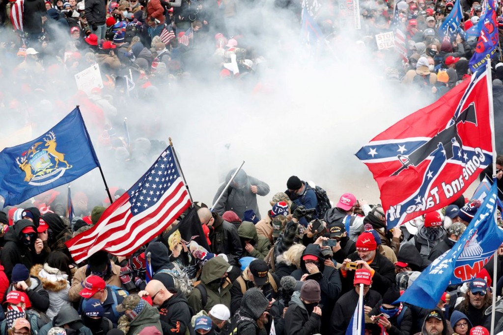 Tear gas is released into a crowd of protesters during clashes with Capitol police at a rally to contest the certification of the 2020 U.S. presidenti...