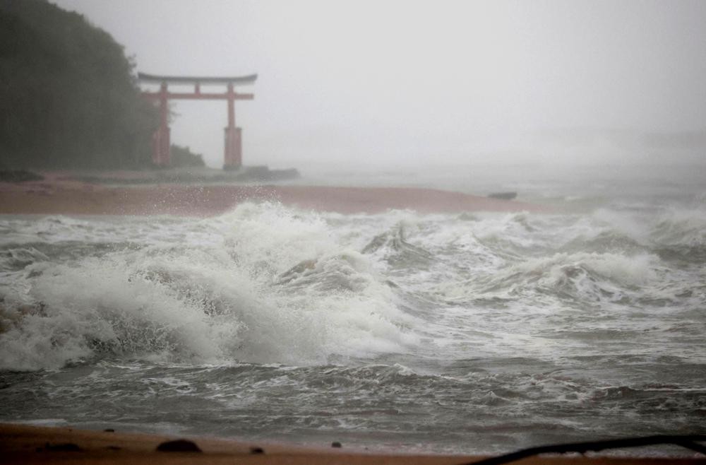 Waves batter the shore in Miyazaki, southern Japan, Sunday, Sept. 18, 2022, as a powerful typhoon approaching southern Japan on Sunday lashed the regi...