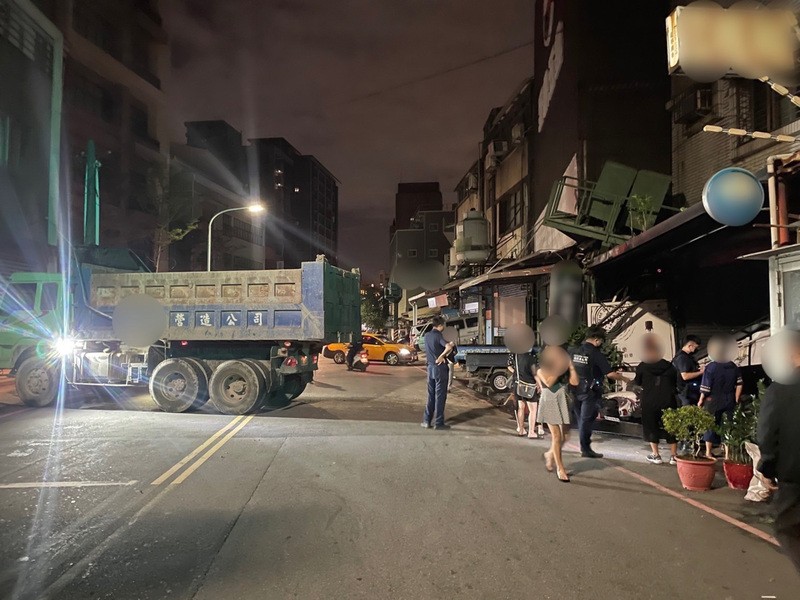 Dump truck, driven by Wu, outside the damaged KTV business.