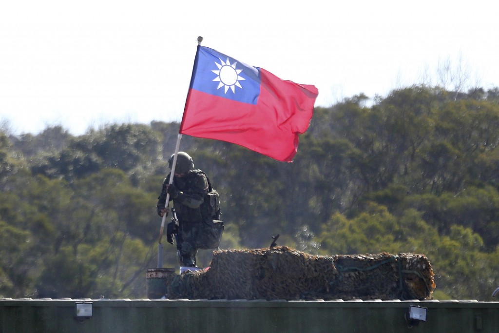 Taiwanese soldier planting the flag in Hsinchu, Taiwan.
