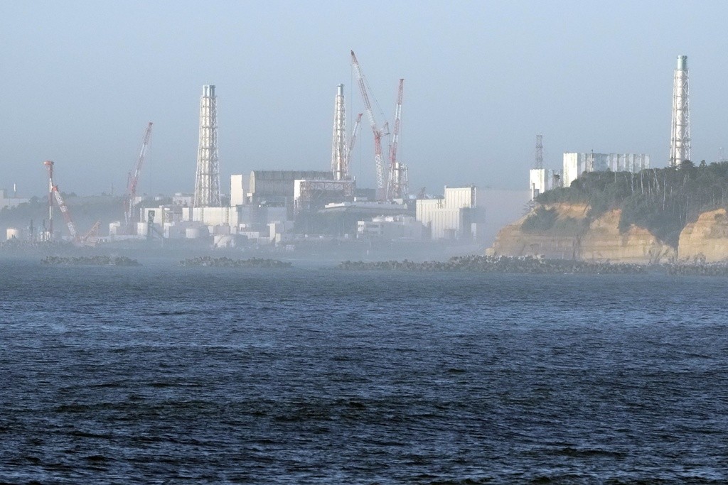 日本東北部浪江町一處漁港可看見福島第一核電廠（圖／美聯社）
