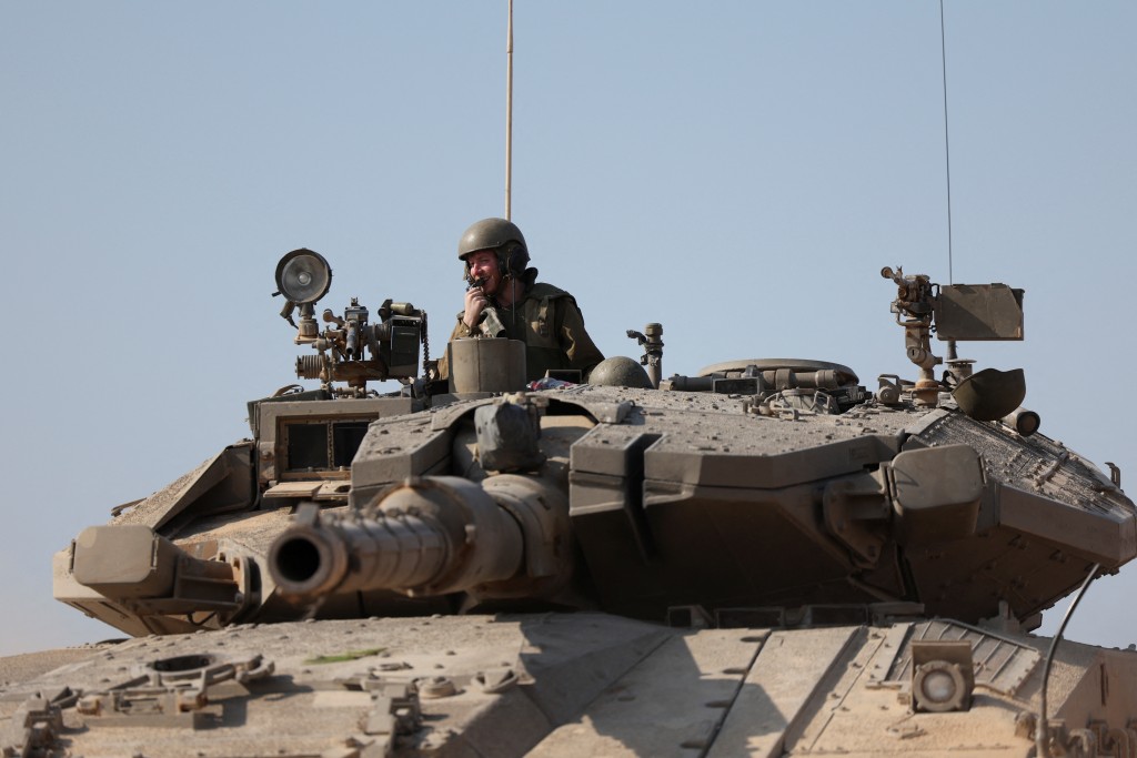 An Israeli tank is seen in the aftermath of a mass infiltration by Hamas gunmen from the Gaza Strip, in Kibbutz Beeri in southern Israel, Oc...