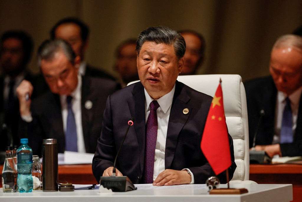 President of China Xi Jinping attends the plenary session during the 2023 BRICS Summit at the Sandton Convention Centre in Johannesburg...