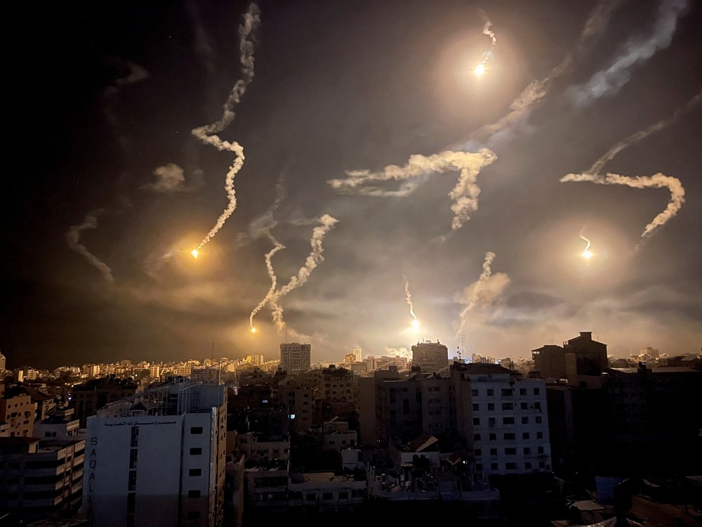 Flares are dropped by Israeli forces, amid the ongoing conflict between Israel and Palestinian Islamist group Hamas, in Gaza City November 6...