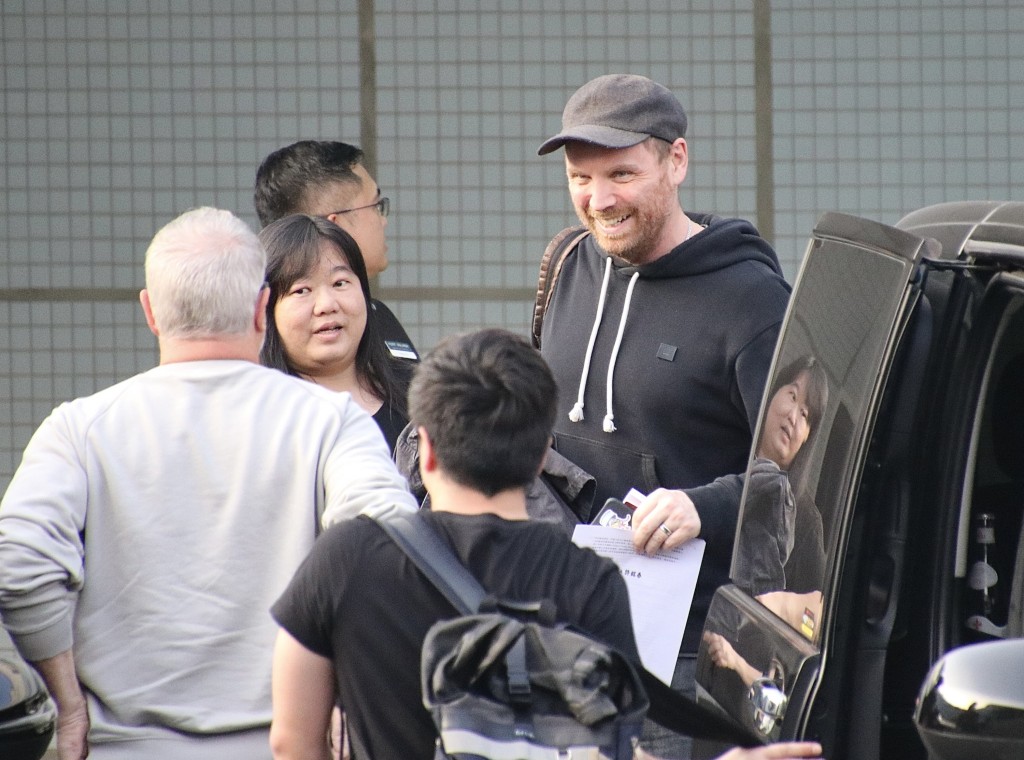 Coldplay guitarist Jonny Buckland (first right) arrives in Kaohsiung Friday. 
