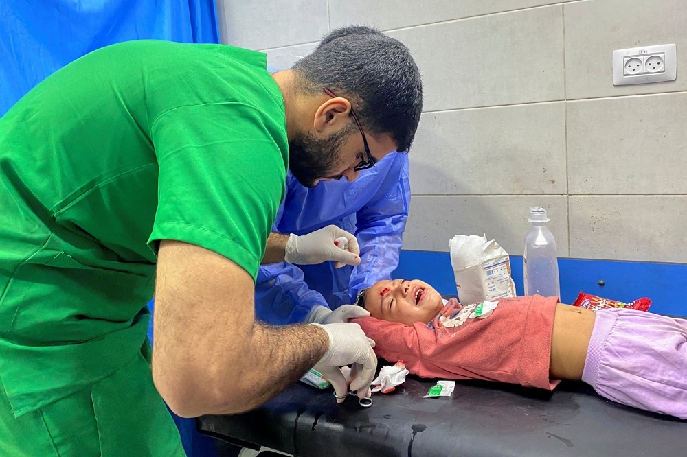 Palestinian girl Orheen Al-Dayah, who was injured on her forehead in an Israeli strike amid the ongoing conflict between Hamas and...