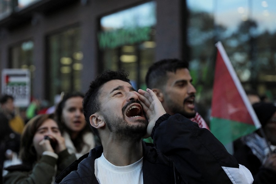 Demonstrators shout slogans during a march in a protest, in solidarity with Palestinians in Gaza, amid the ongoing conflict between Israel a...