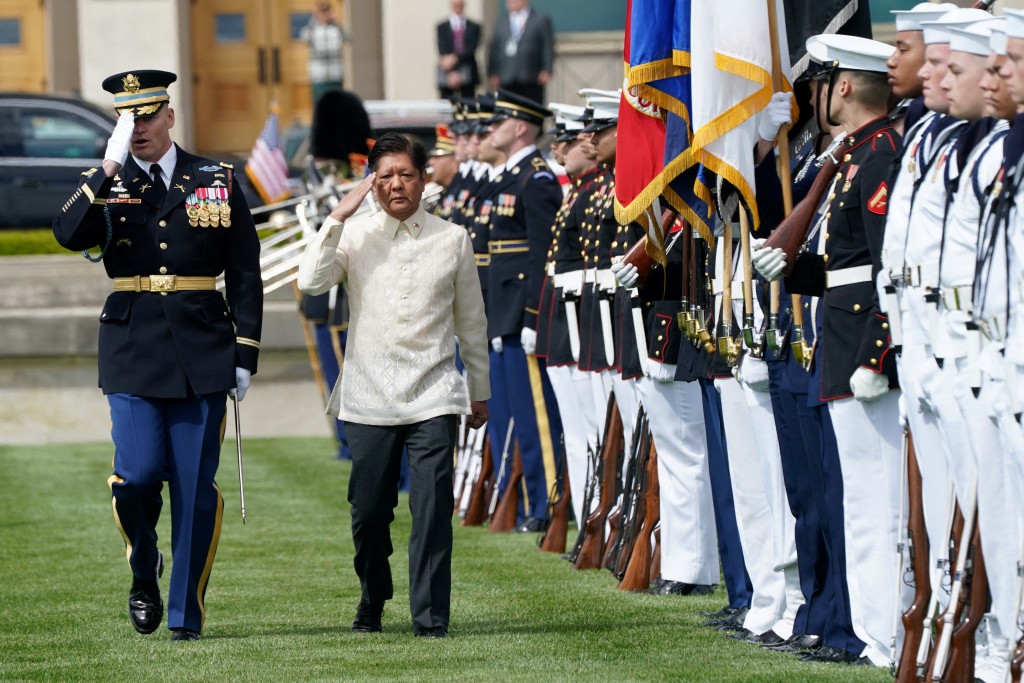 FILE PHOTO: Philippine President Ferdinand Marcos Jr. reviews a military honor guard during a full honors arrival ceremony at the Pentagon in Washingt...