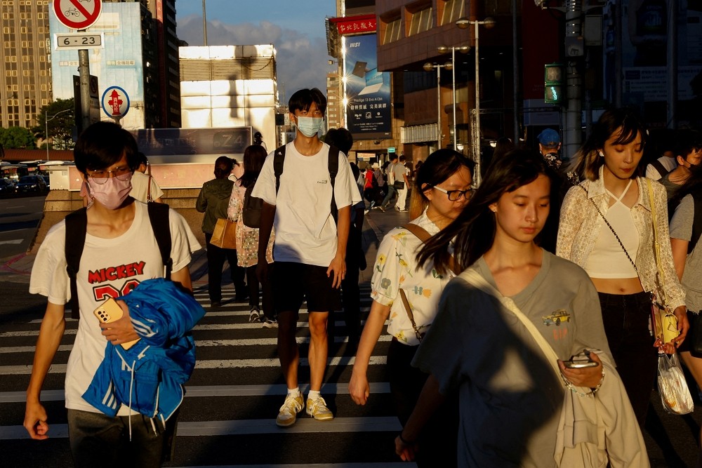 People walk on the street in Taipei, Taiwan July 25, 2023. REUTERS/Ann Wnag
