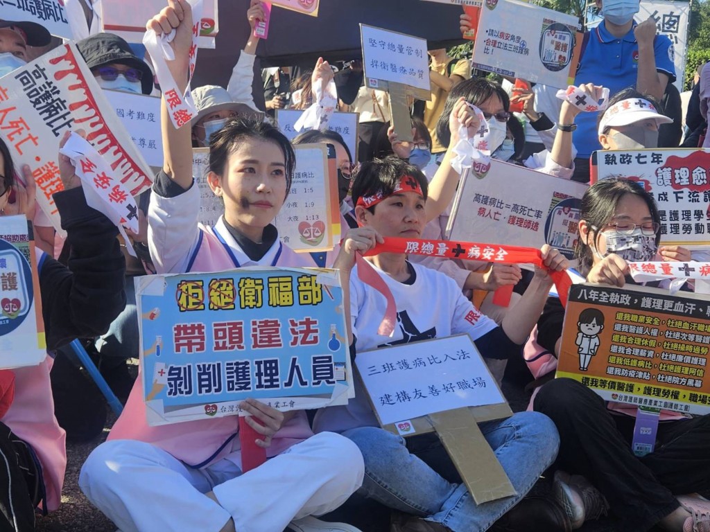 Nurses and other healtchcare professionals protest in Taipei during 'Black Cross' march, Nov. 19. 
