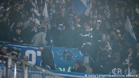 Several people were injured after a firecracker was thrown in the stands of a Augsburg-Hoffenheim match