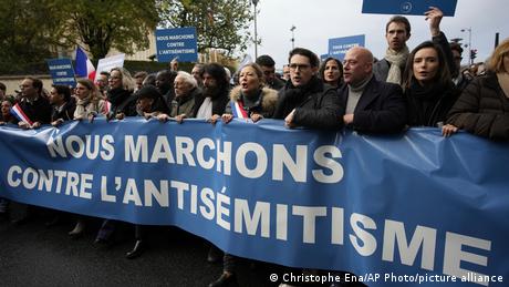 Thousands of people concerned with the rise of antisemitism were joined by far-right politician Marine Le Pen
