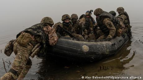 Ukrainian marines cross the Dnipro River in small boats in the southern Kherson region