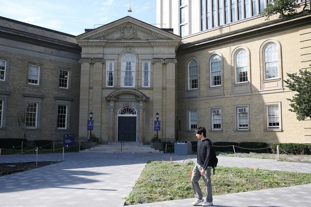 A student walks in front of the University of Toronto, St. George campus, in Toronto, Ontario, Canada September 26, 2023. REUTERS/...