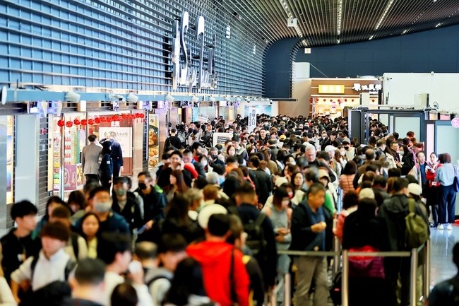 Crowded scene inside Taiwan Taoyuan International Airport. 
