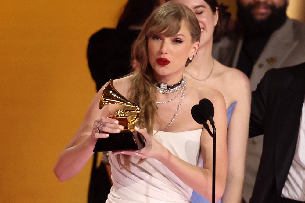 Taylor Swift accepts the award for Album of the Year for Midnights during the 66th Annual Grammy Awards in Los Angeles, California, U.S., Fe...