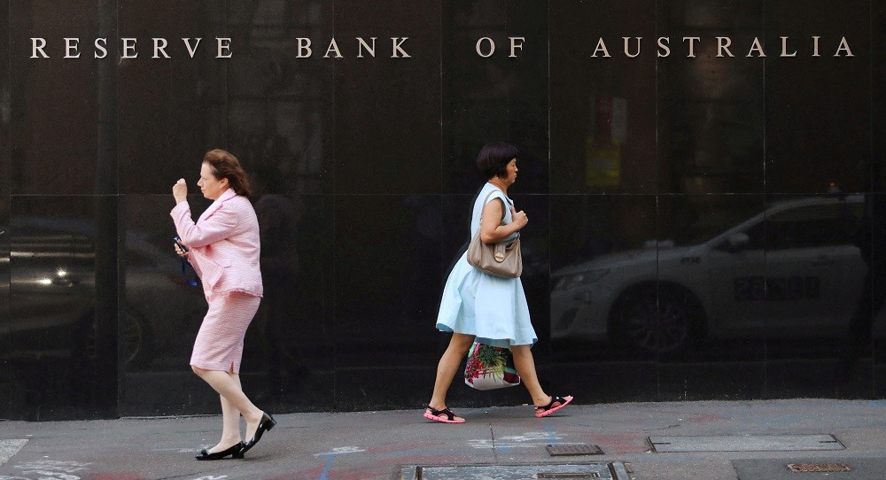 Two women walk next to the Reserve Bank of Australia headquarters in central Sydney, Australia February 6, 2018. RE...