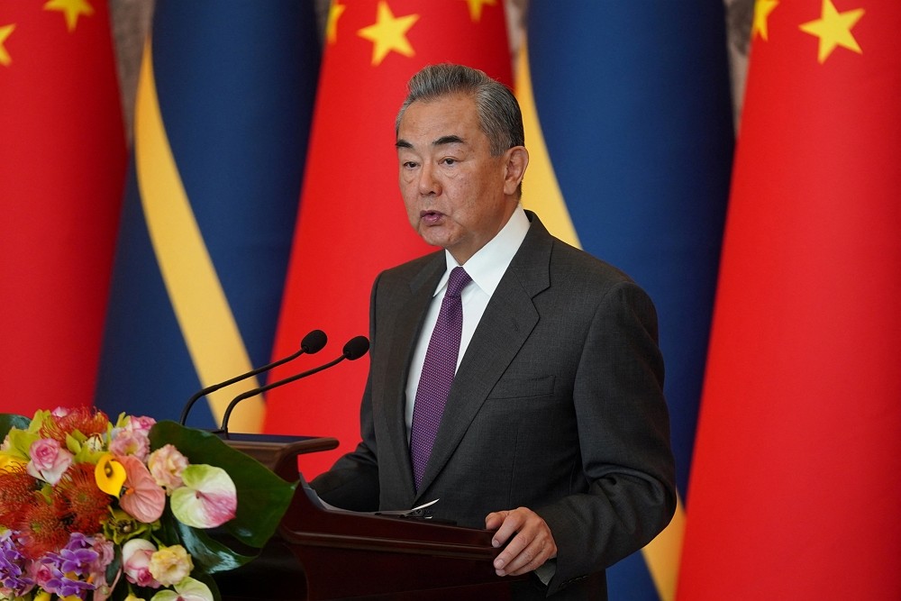Chinese Foreign Minister Wang Yi gives a speech after signing the Joint Communique on the Resumption of Diplomatic Relations between Ch...