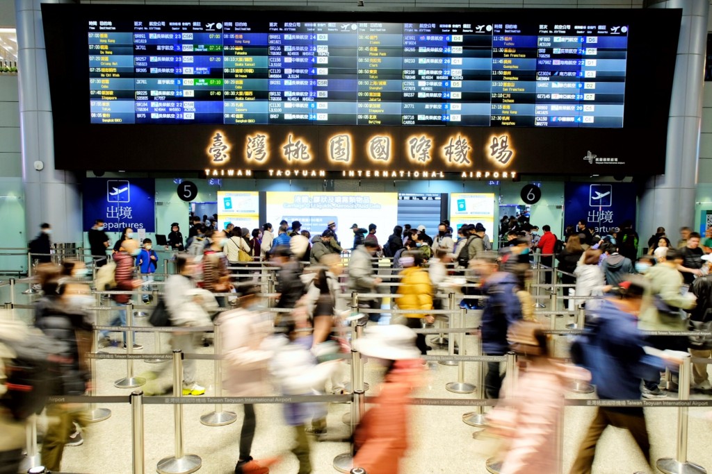 Travelers at Taoyuan International Airport. 
