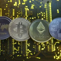 Cryptocurrencies pause after weekend battering, other currencies wait for Fed
