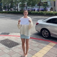 Daughter of Chinese activist in Taipei holds up white paper to support 'A4 Revolution'  